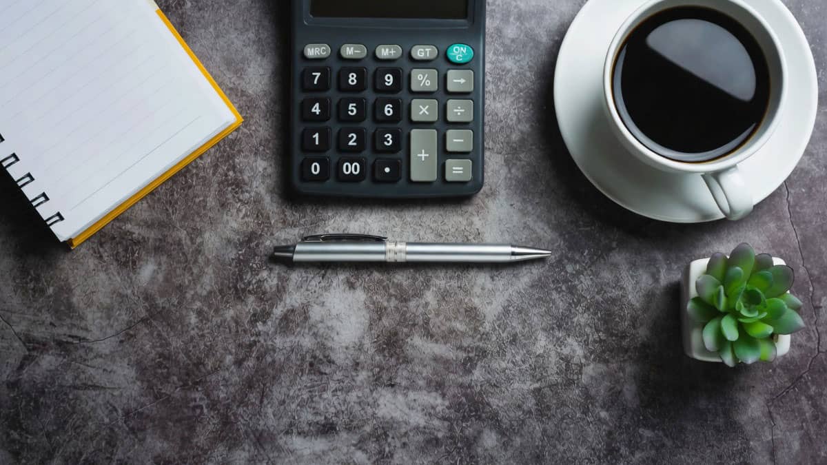 Owner working out how much a marketing agency costs for a home service business